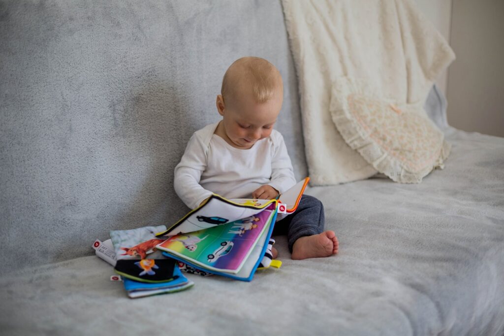 The Best Books for One-Year-Olds Baby reading a book